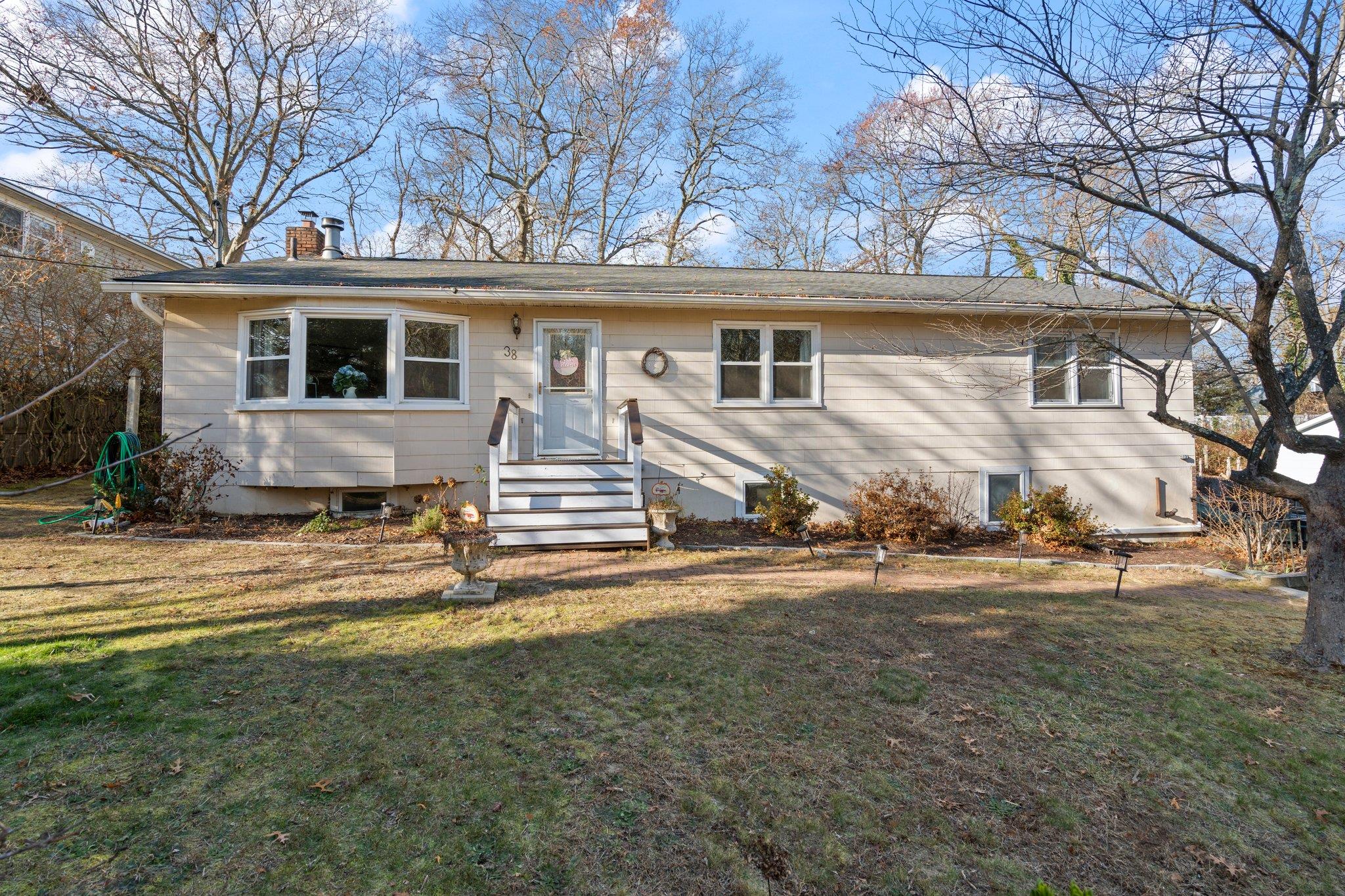 View of front of property with a front yard