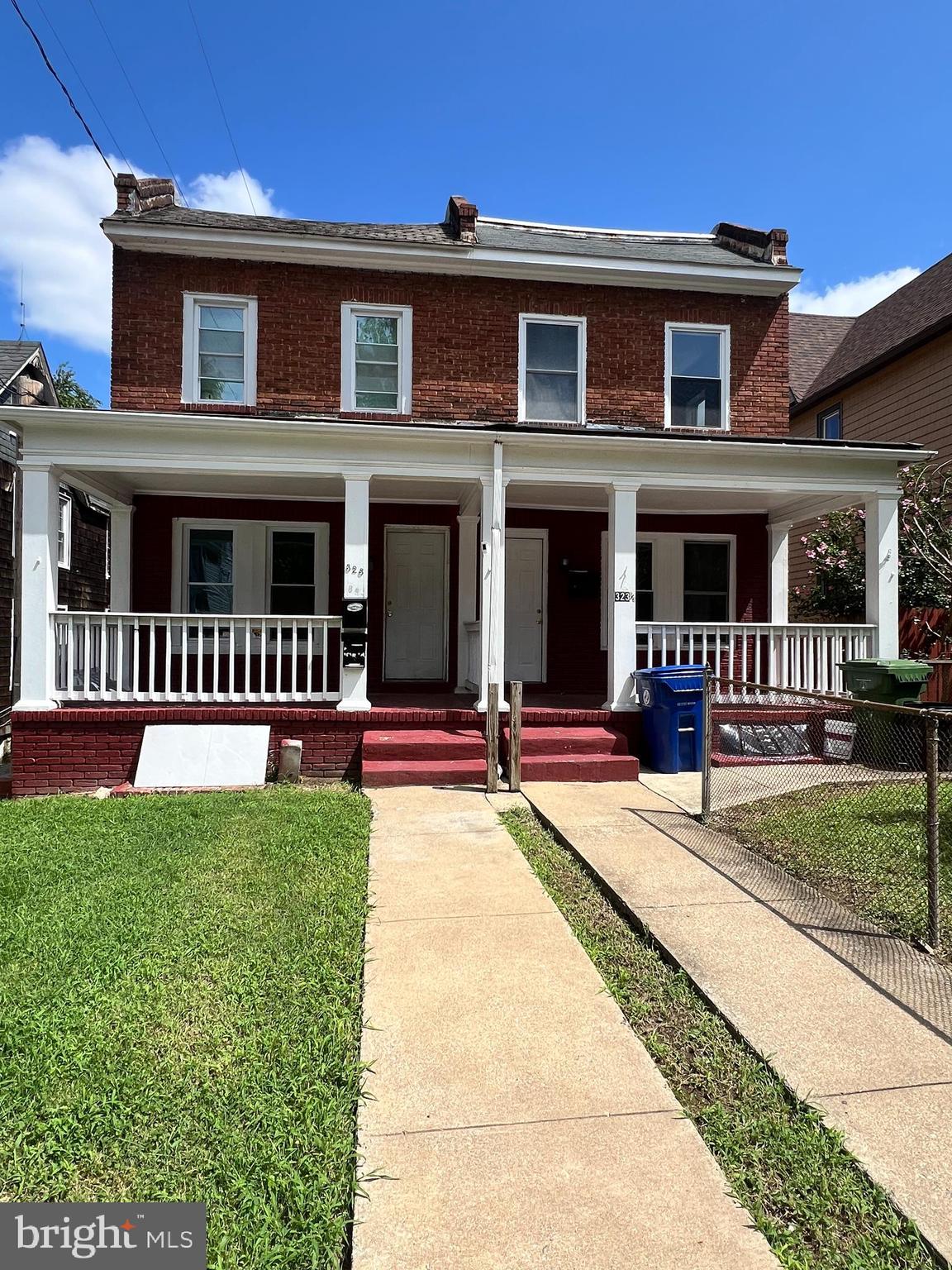 a front view of a house with yard