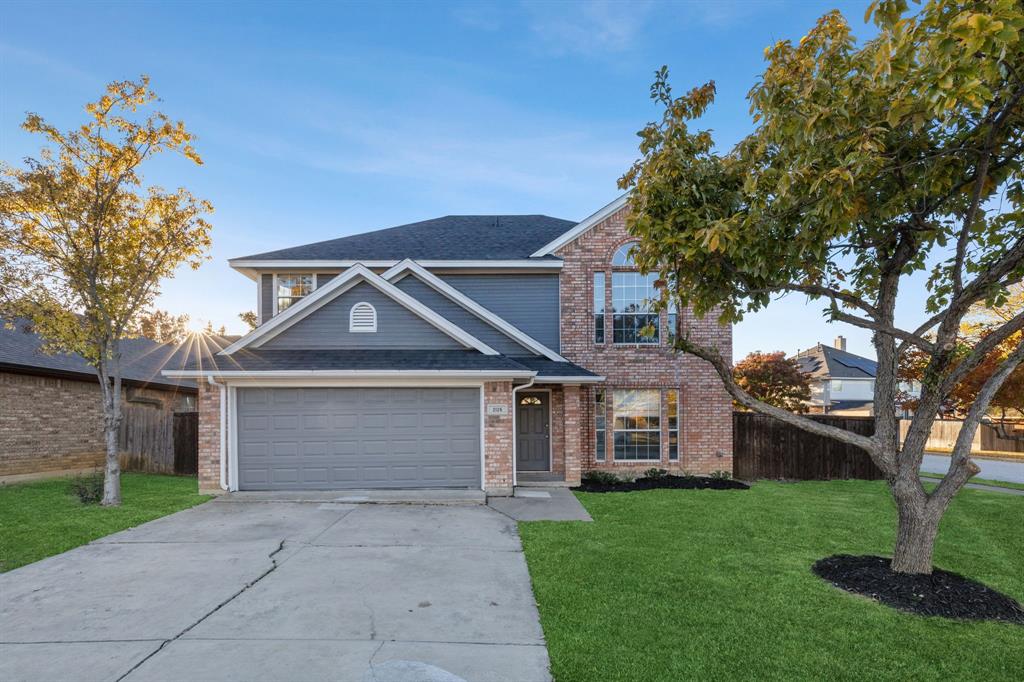 front view of a house with a yard