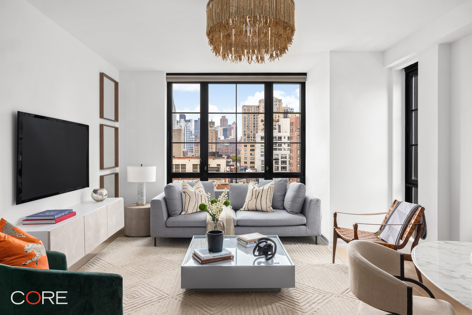 a living room with furniture and a flat screen tv