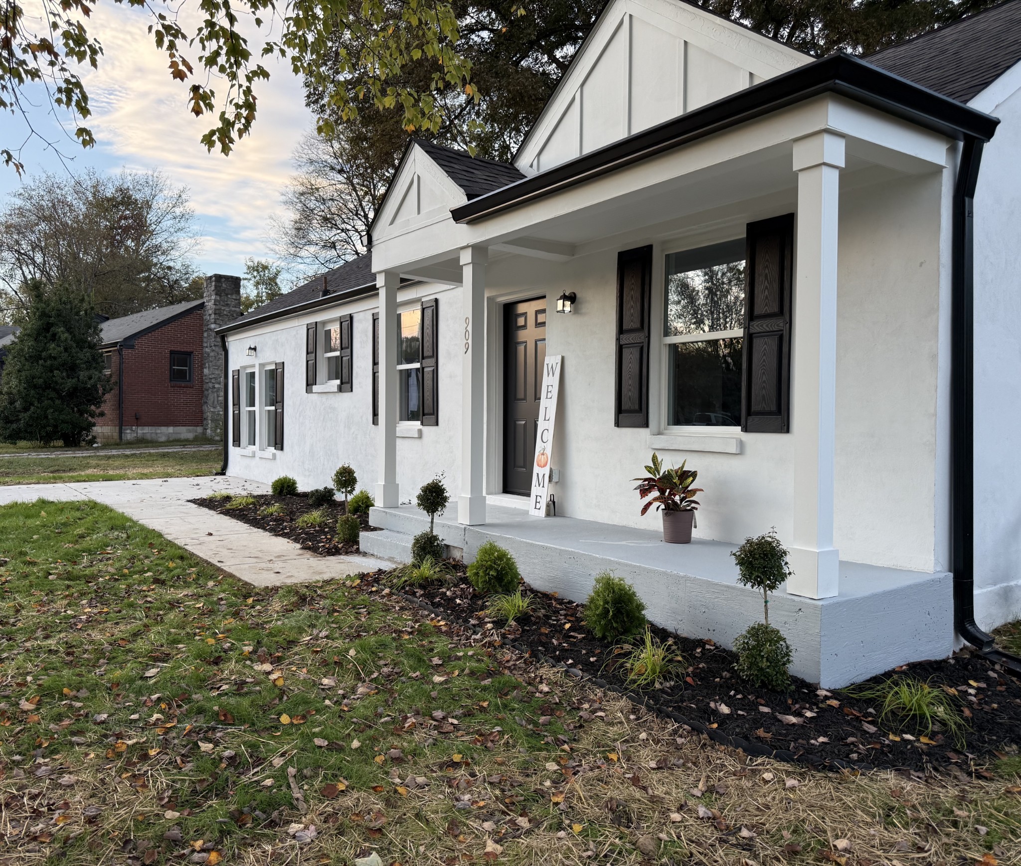 a front view of a house with garden