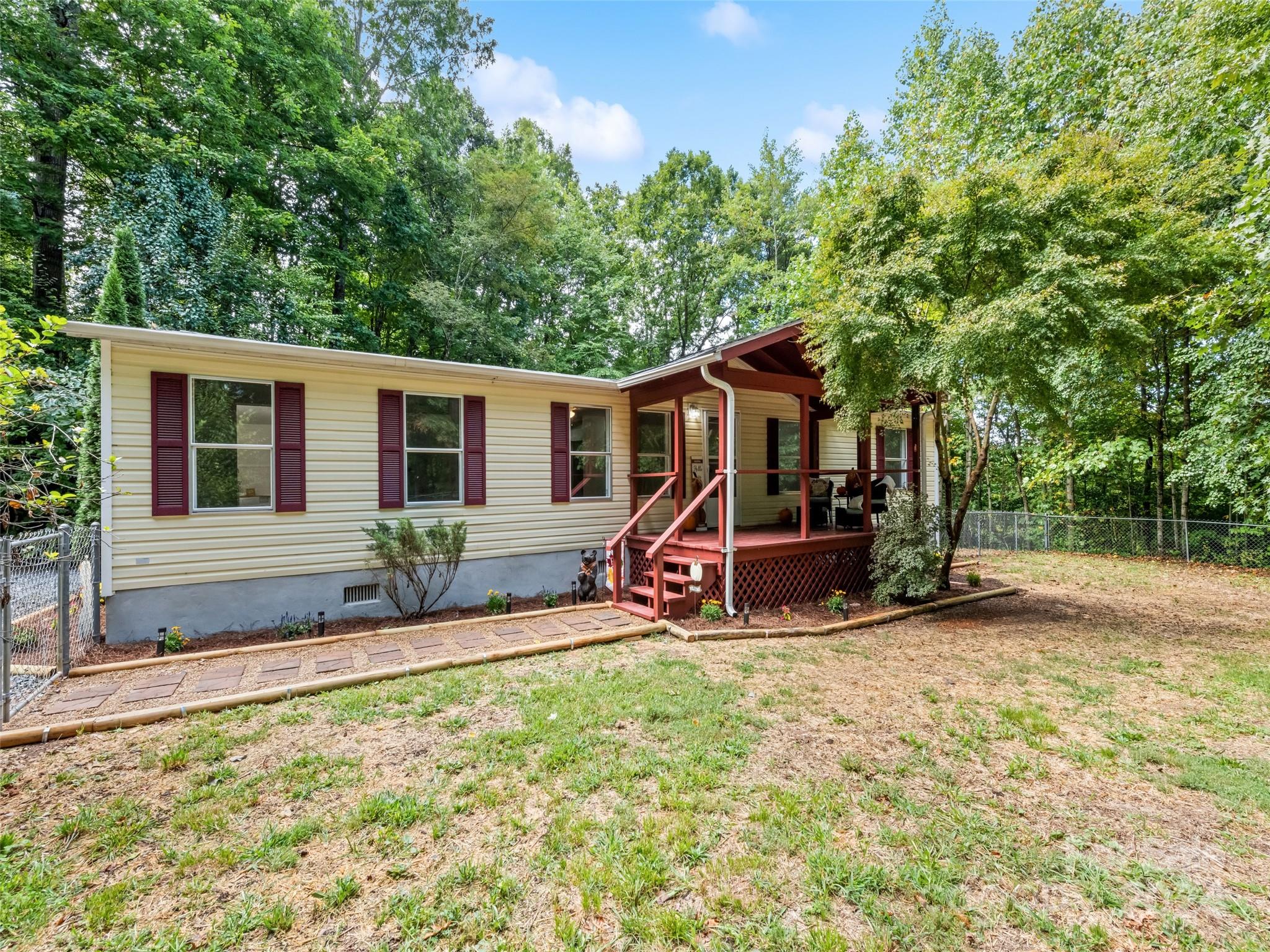 a view of a house with backyard porch and sitting area