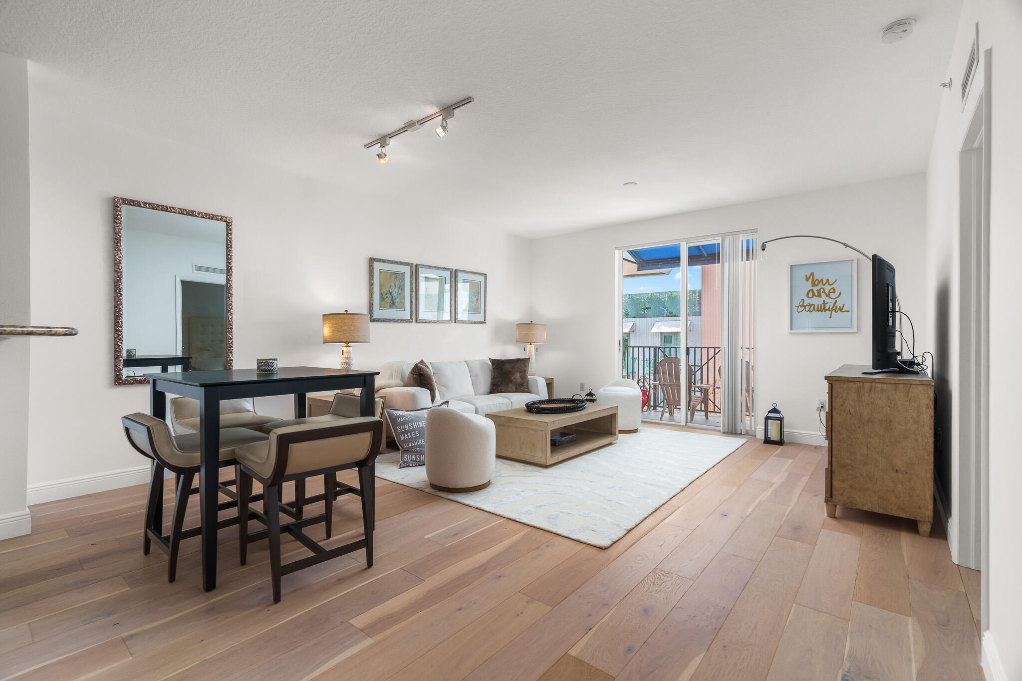 a view of a livingroom with furniture and a table