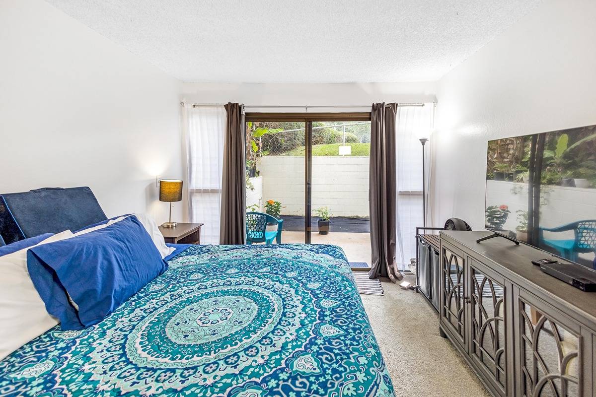 Primary bedroom with private terrace access