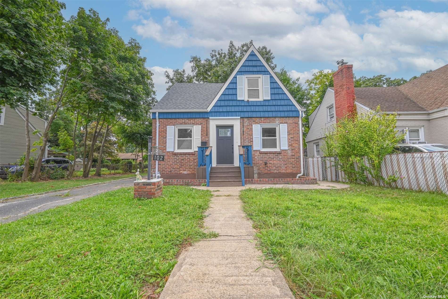 front view of a house with a yard