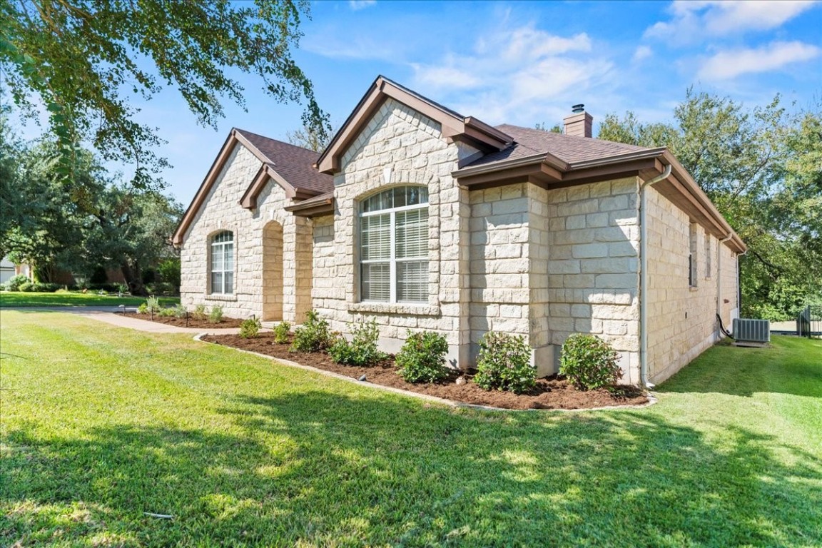 a front view of a house with a yard and porch