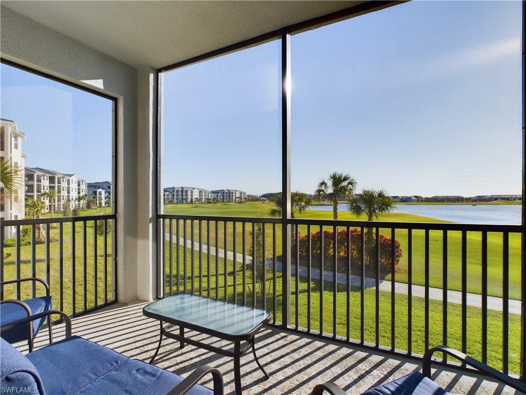 Sunroom with a water view