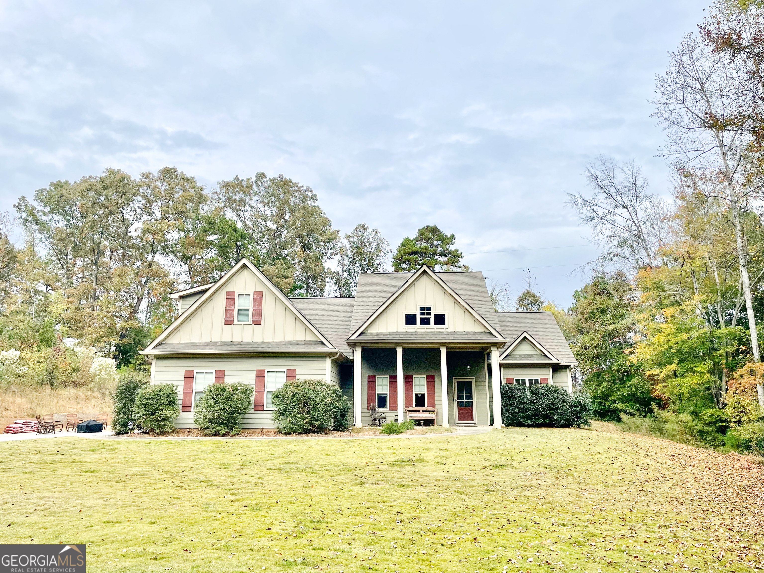 a front view of a house with a garden