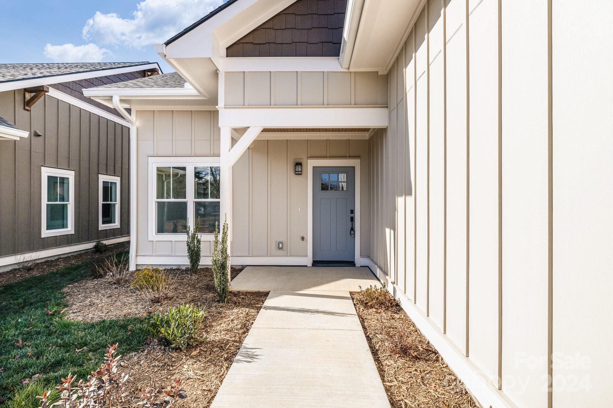 a view of a house with a small yard