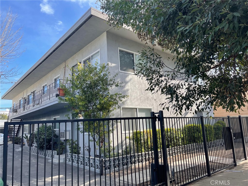 a view of a wrought iron fences in front of house