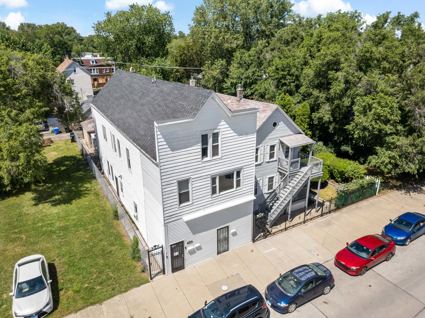 a aerial view of a house with yard