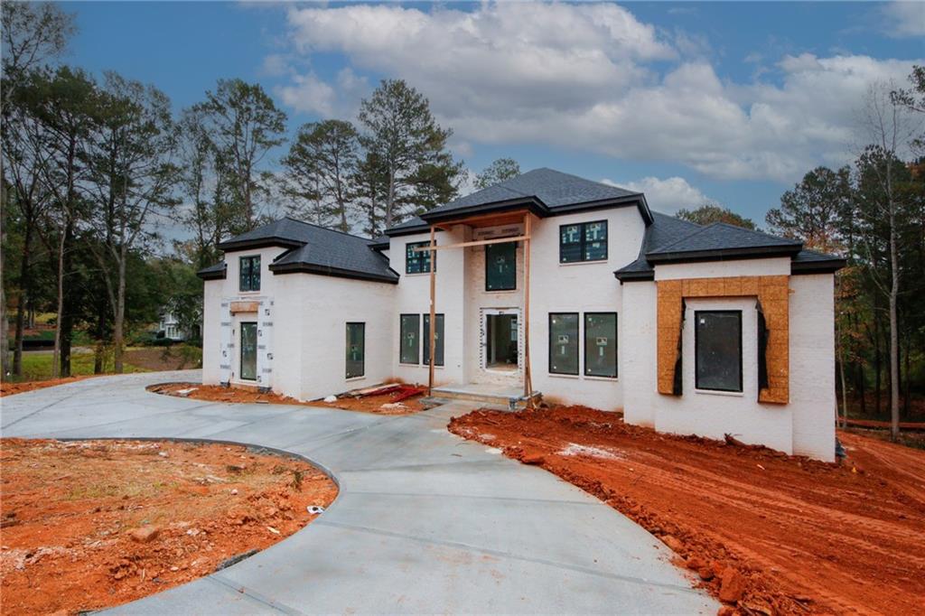 a front view of a house with a yard