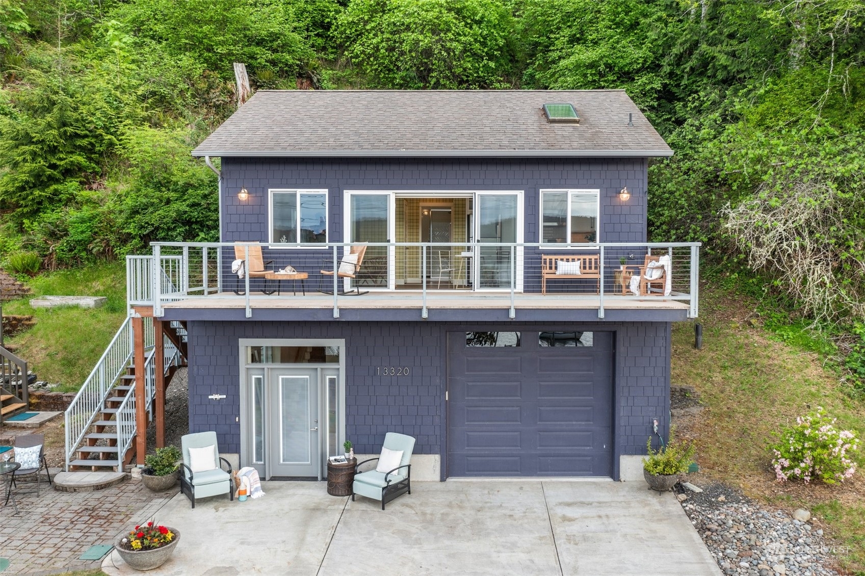 a front view of a house with a garden