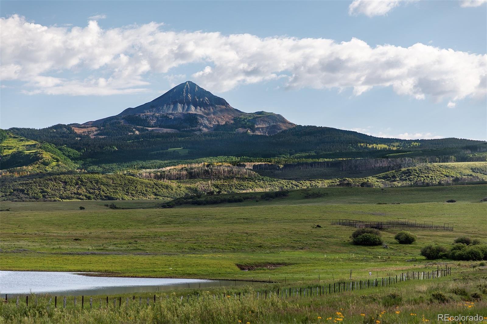 a view of a lake with a mountain in the background