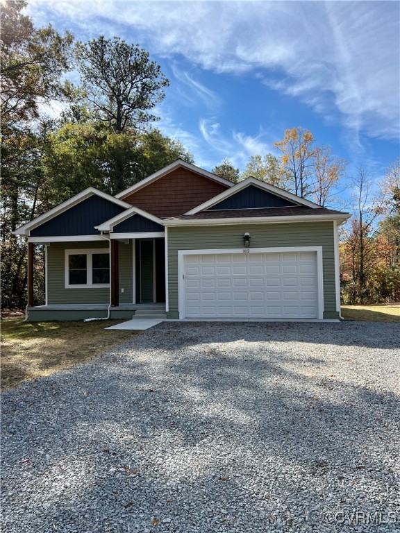 View of front of property with covered porch and a