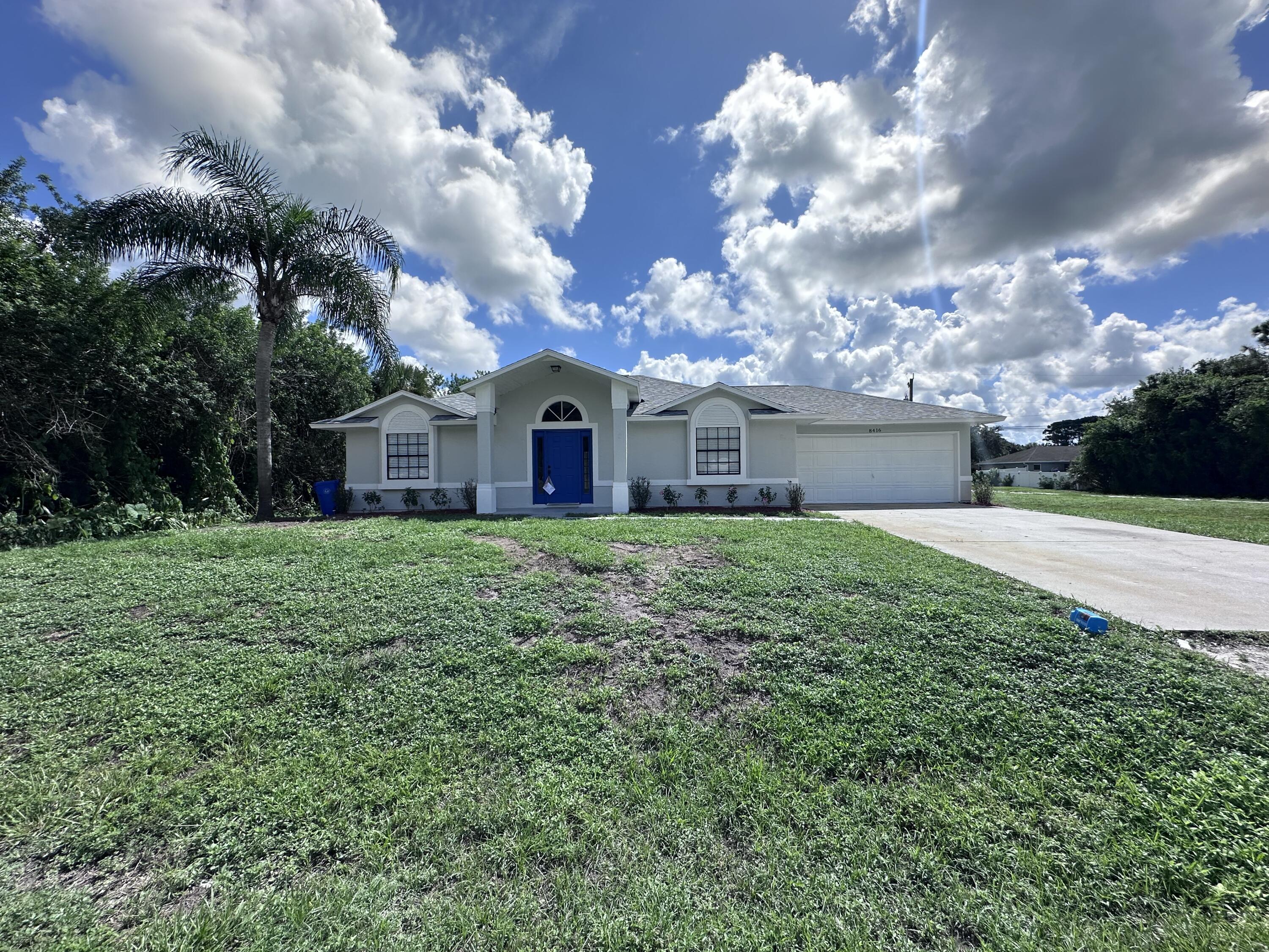 a view of a house with a yard