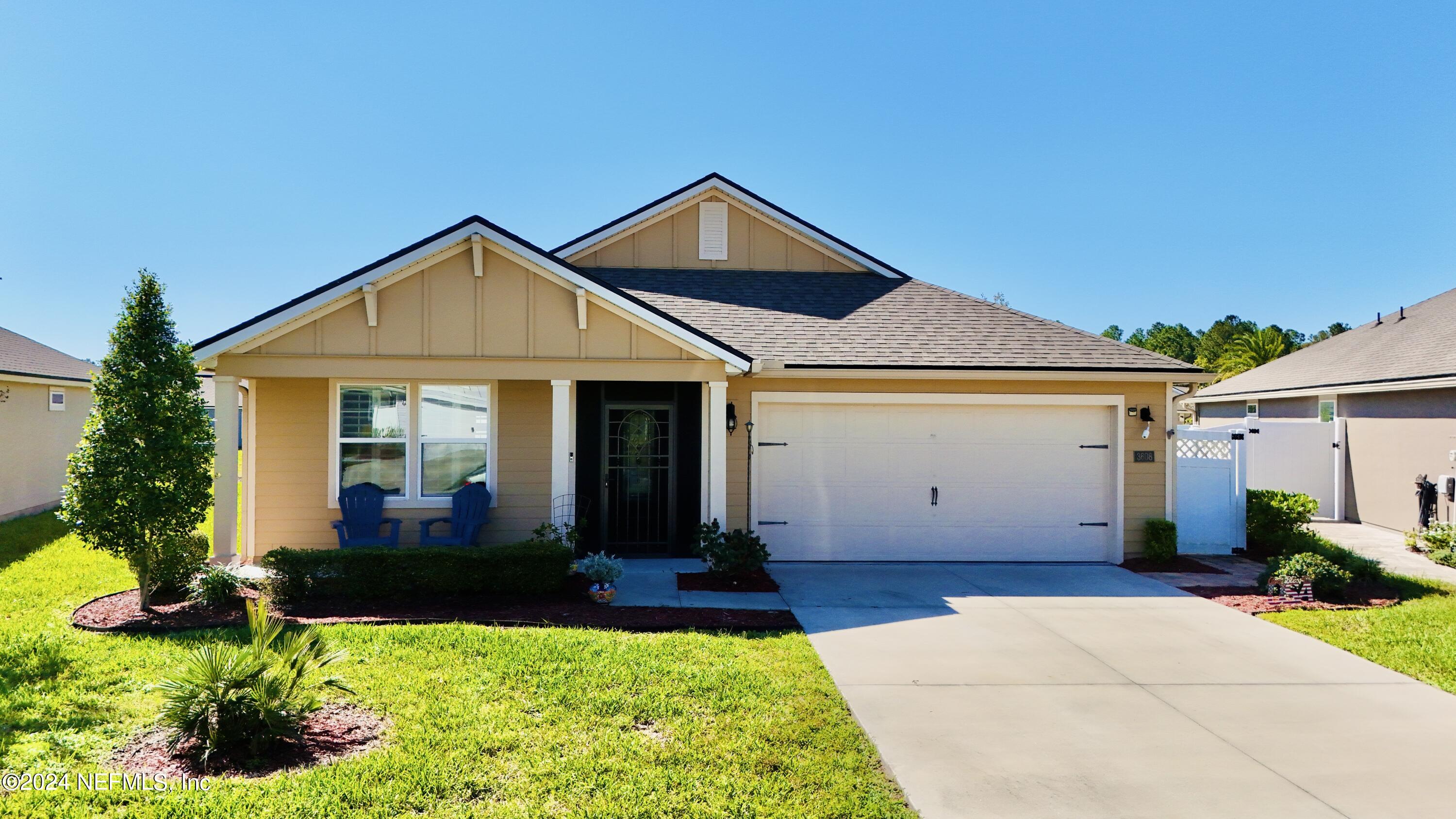 a front view of a house with a yard outdoor seating and yard