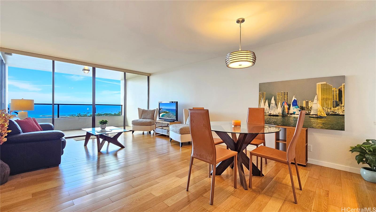 a view of a dining room with furniture window and wooden floor