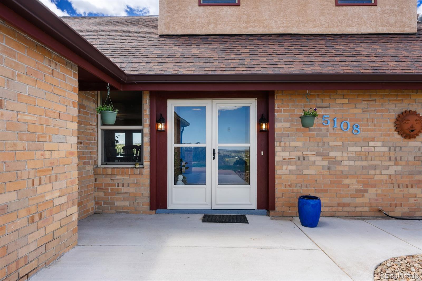 a front view of a building with seating area