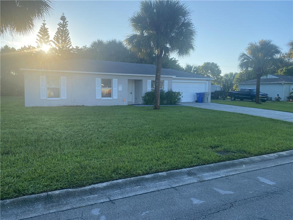 a view of a house with a back yard