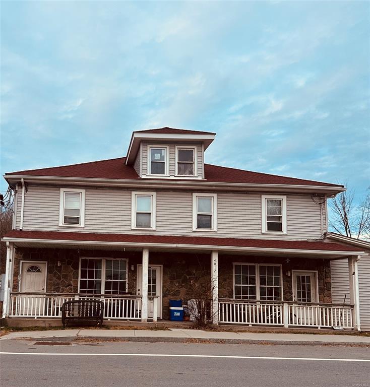 View of front of property with covered porch