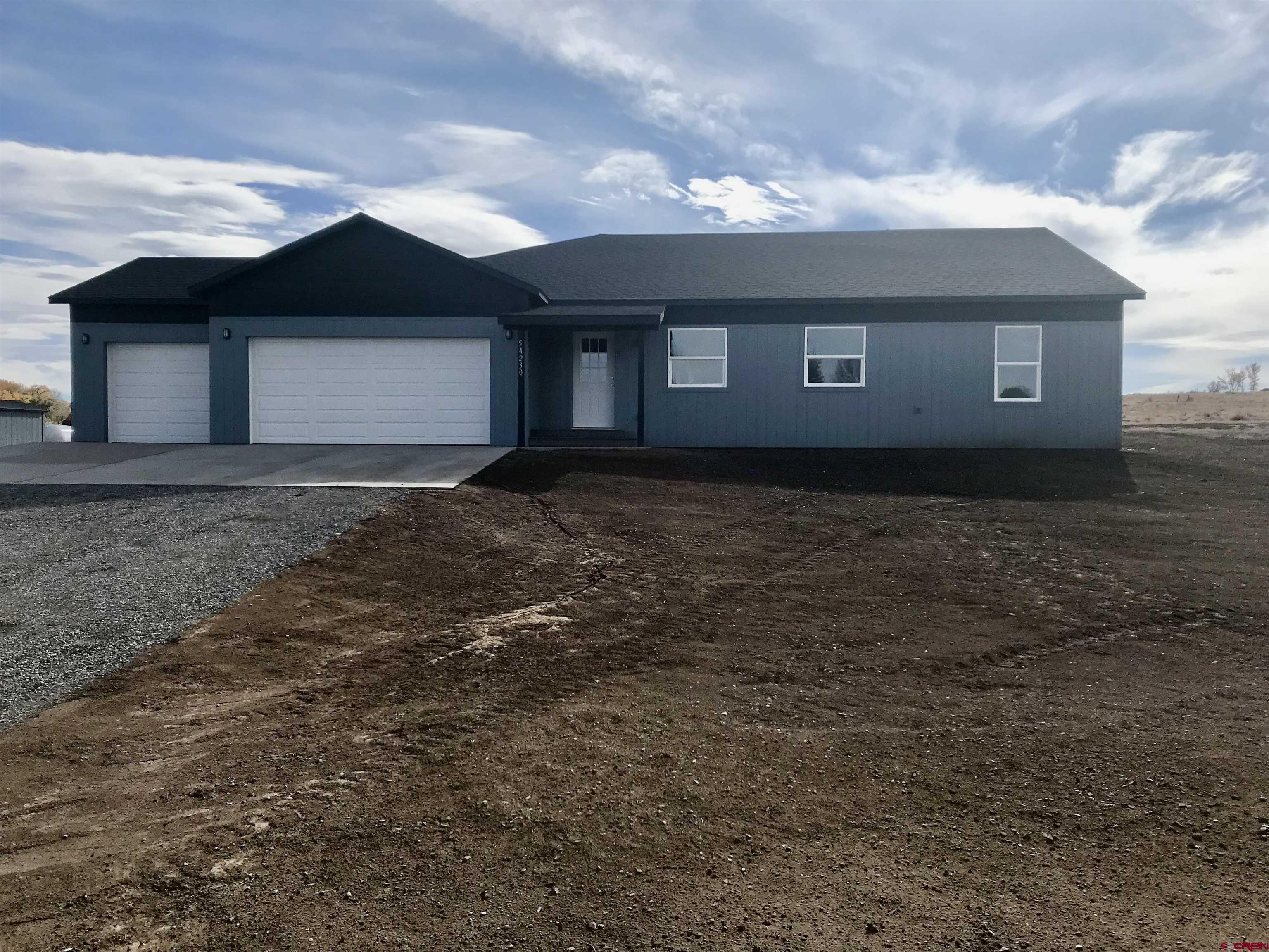 a front view of a house with yard