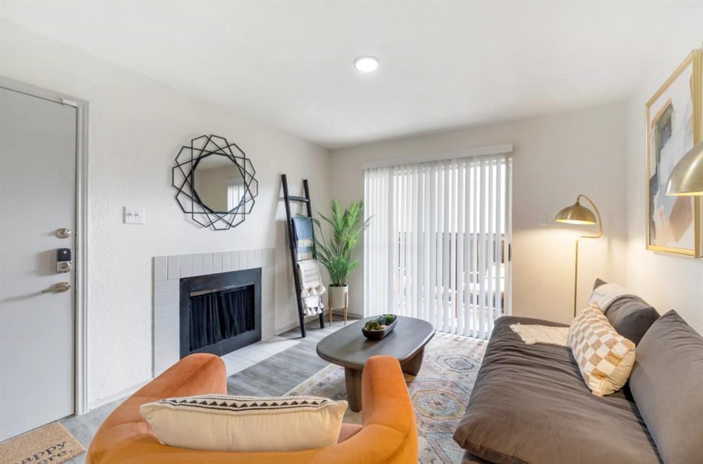 a bedroom with furniture and a fireplace