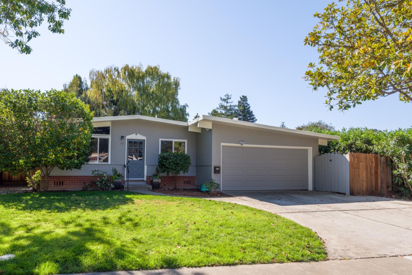 front view of a house with a yard