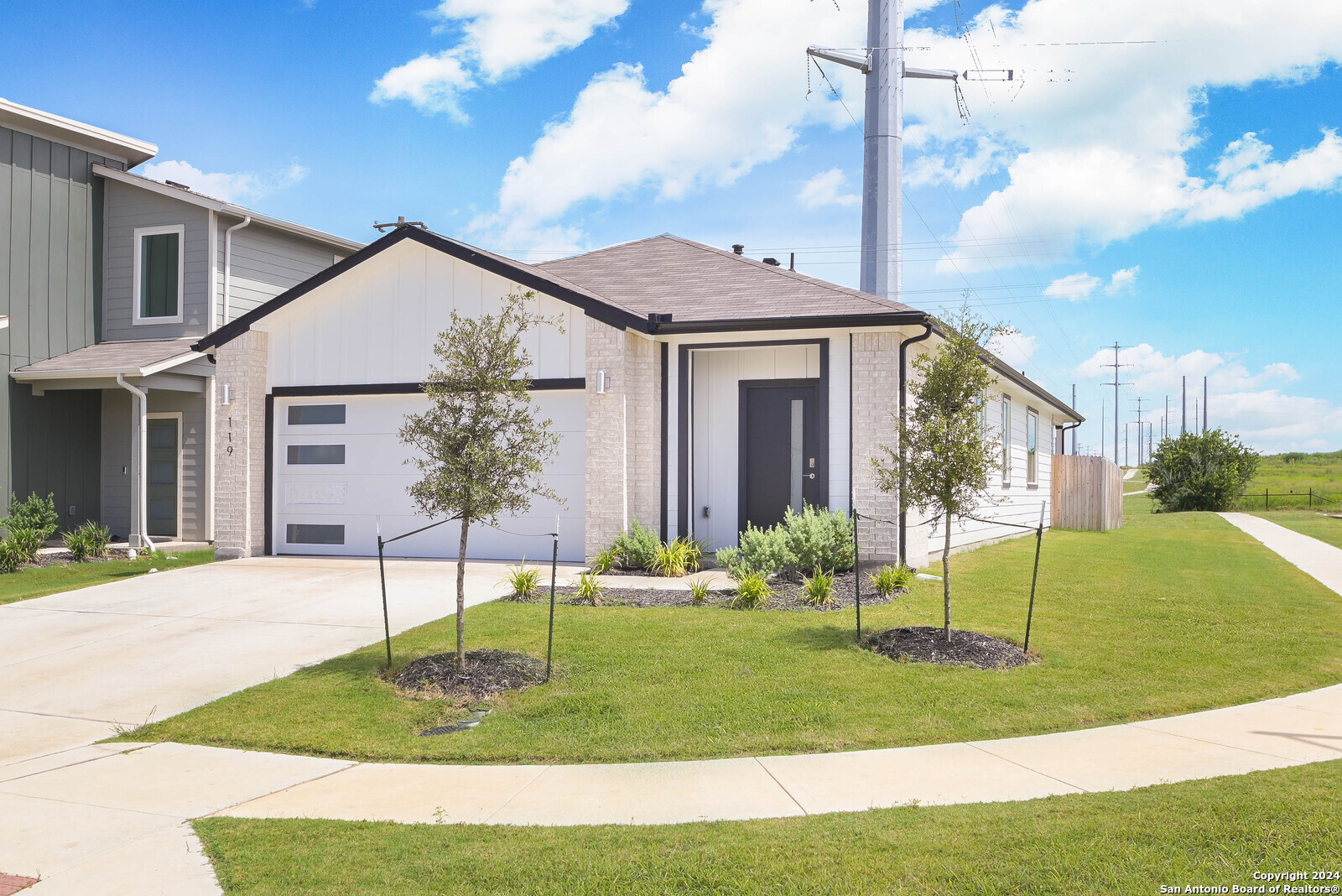 a front view of a house with a yard