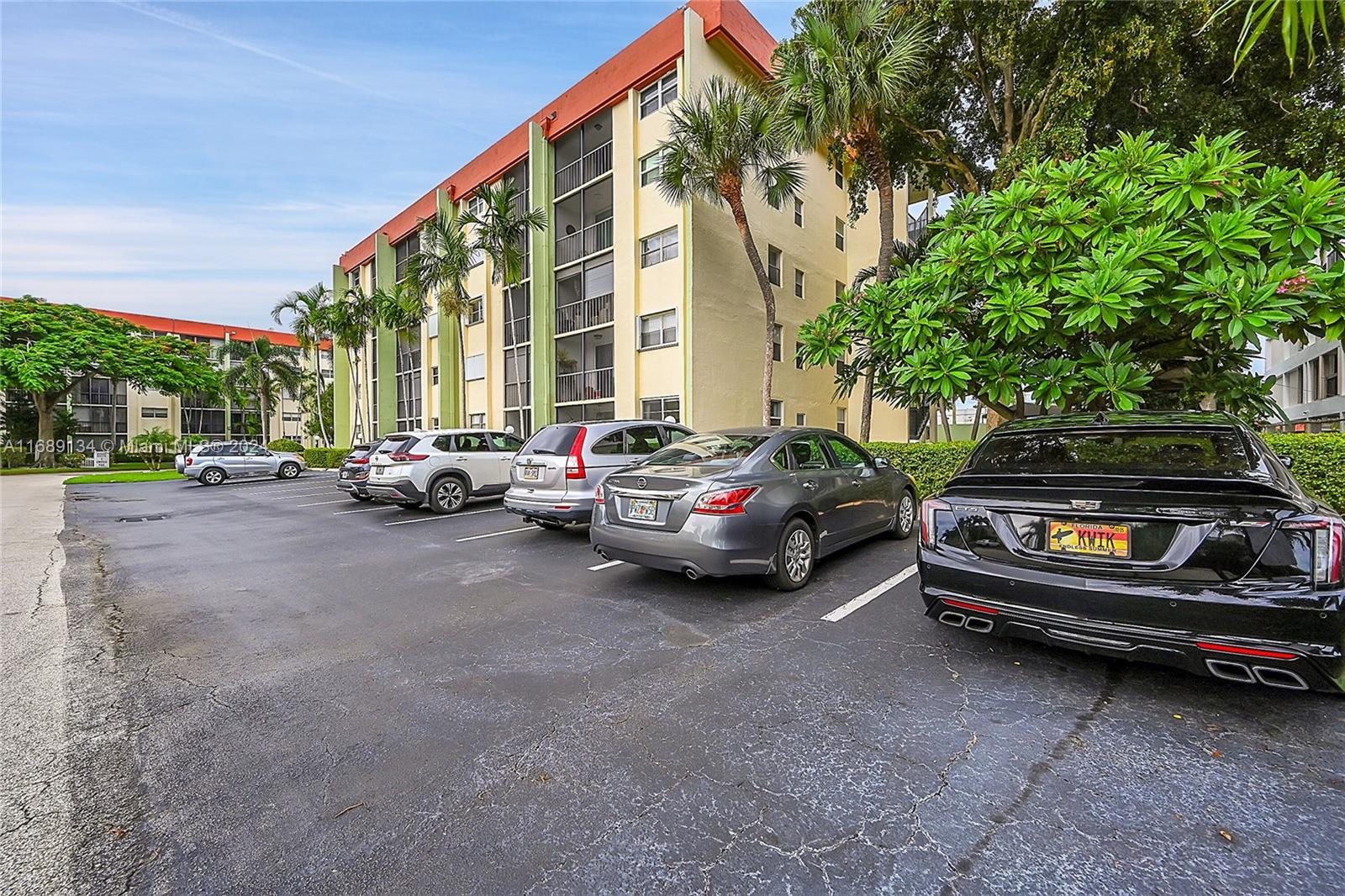 a view of cars parked in front of a building