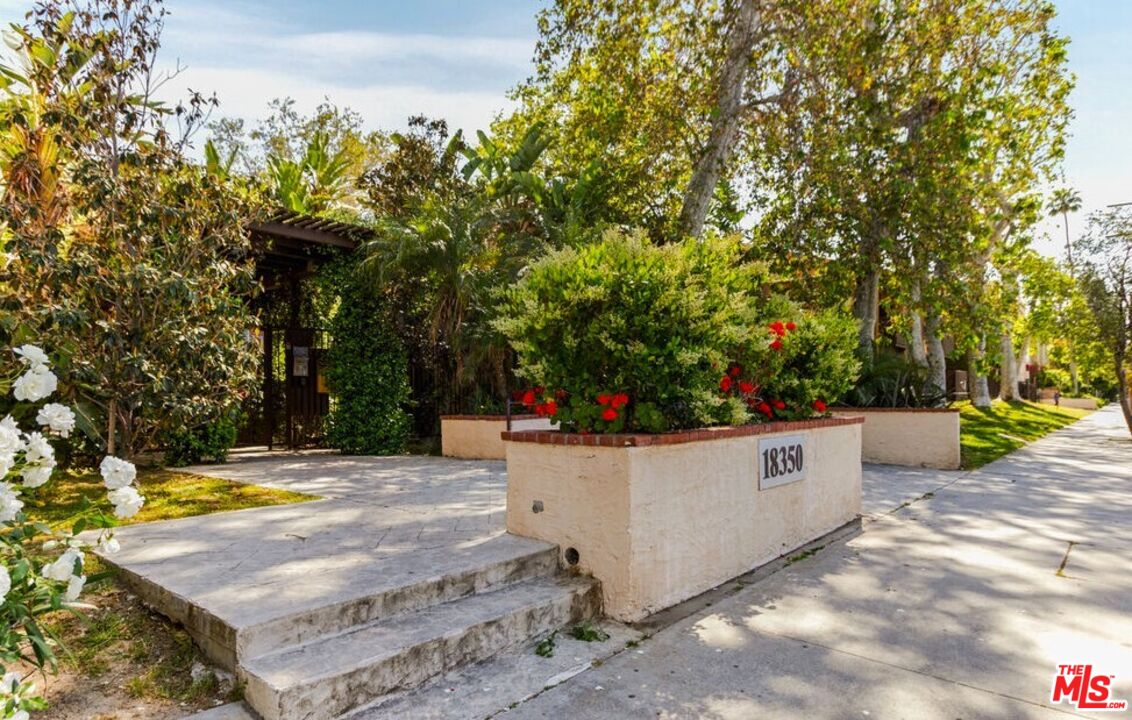 a view of a backyard with swimming pool