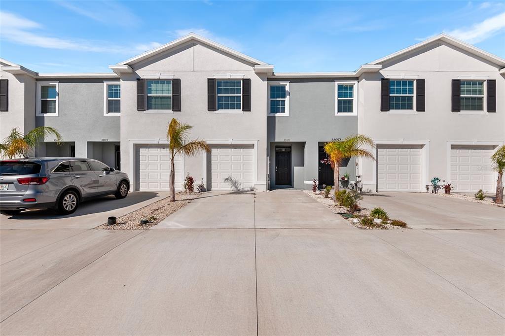 a view of a car park in front of house