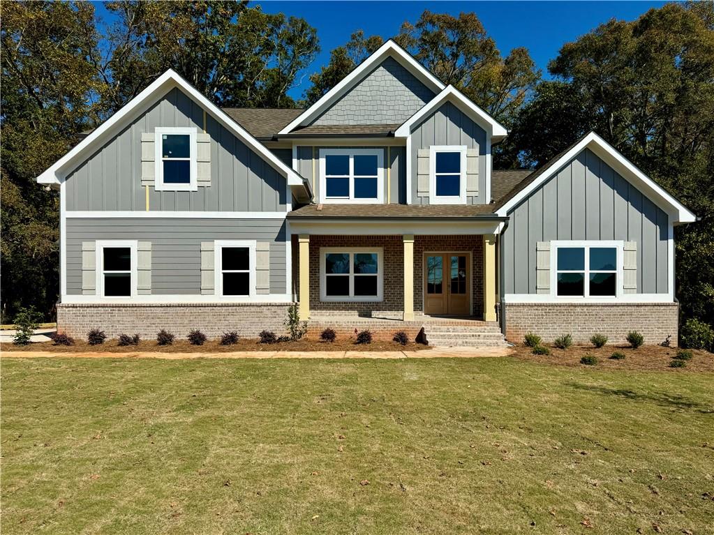 a front view of a house with a yard