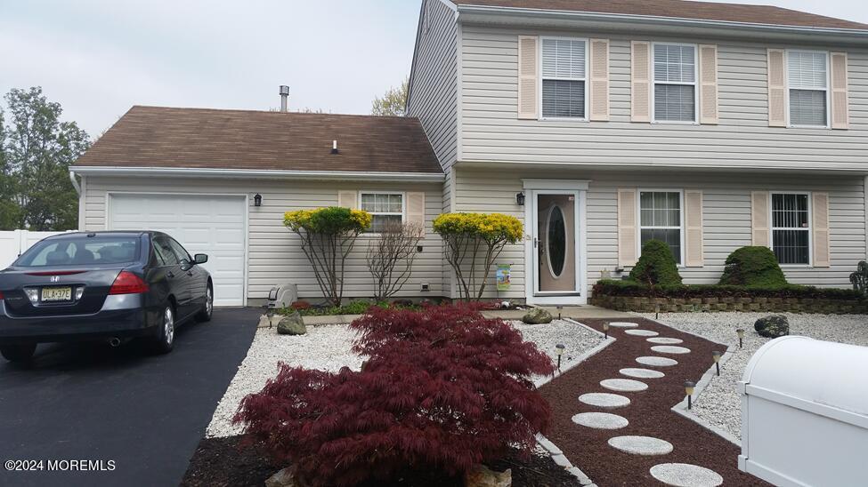 a view of a car park in front of house