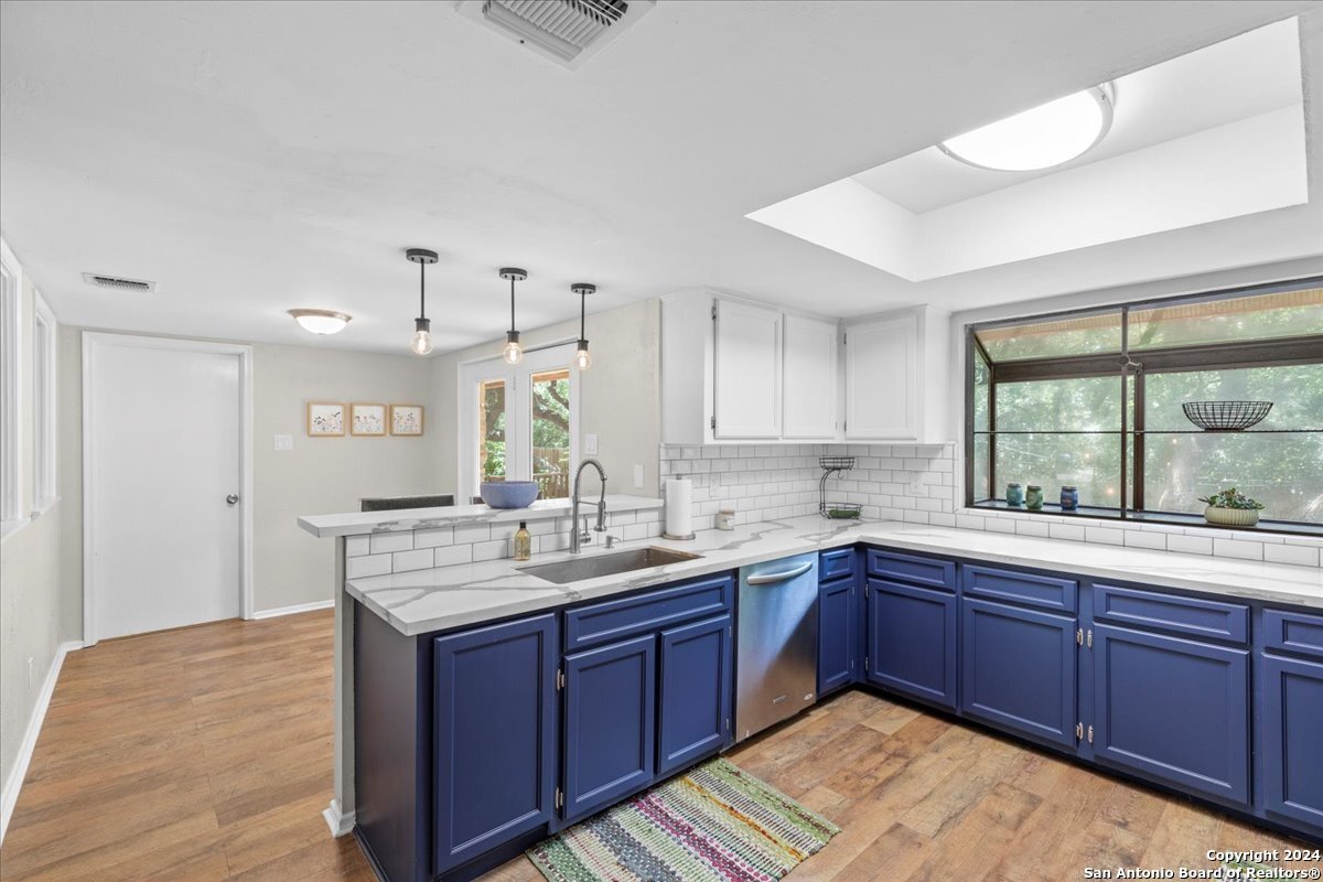 a kitchen with lots of counter space and a sink