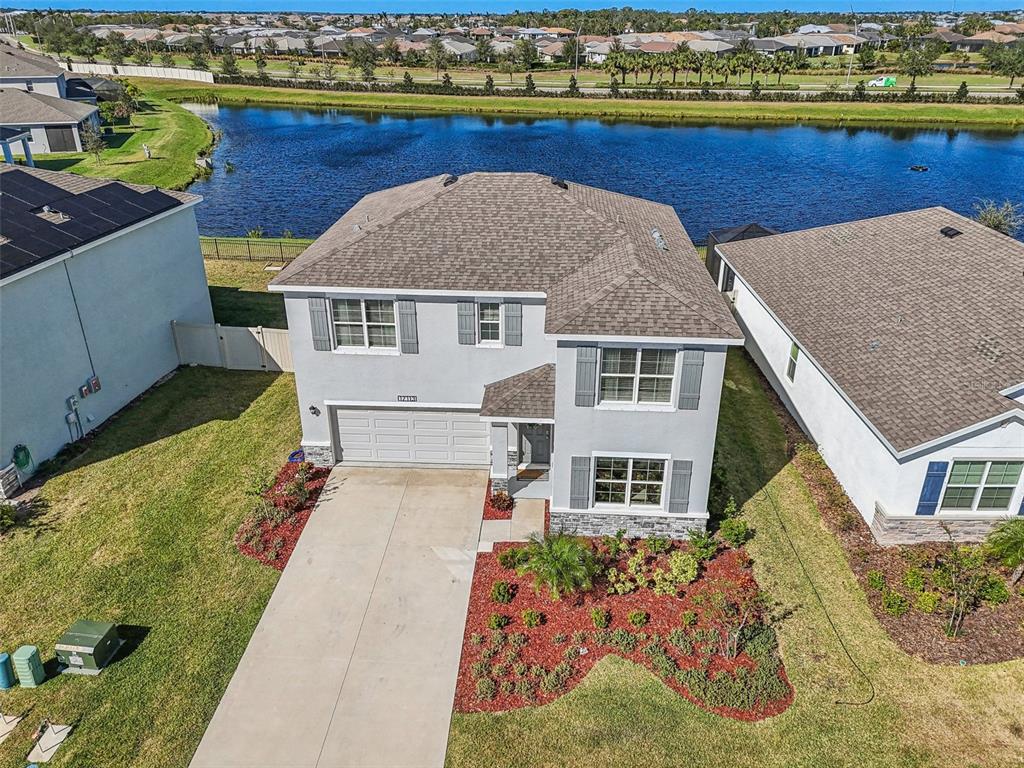 a aerial view of a house with a yard