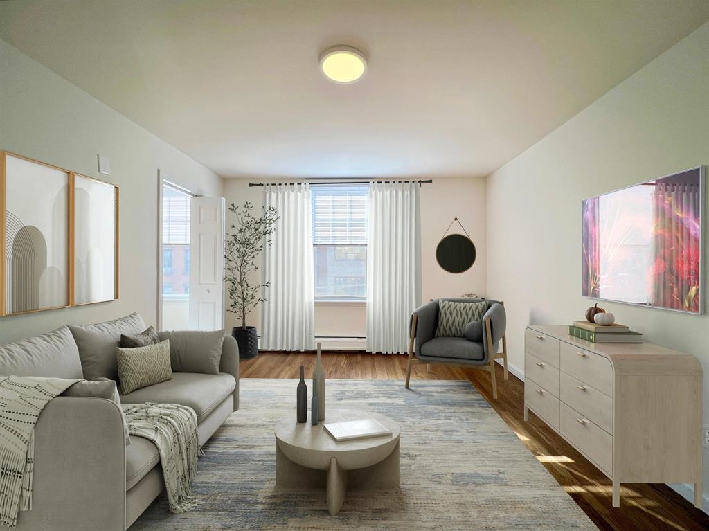 a living room with furniture and a large window