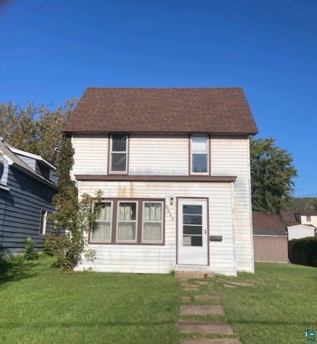 View of front of home with a front yard