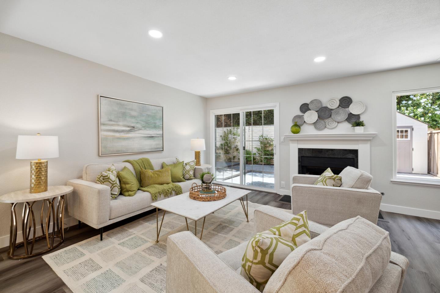 a living room with furniture and a fireplace