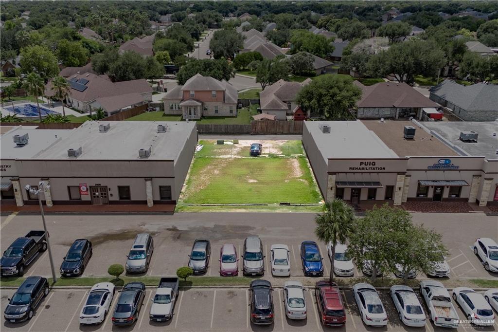 an aerial view of a house with swimming pool and outdoor space