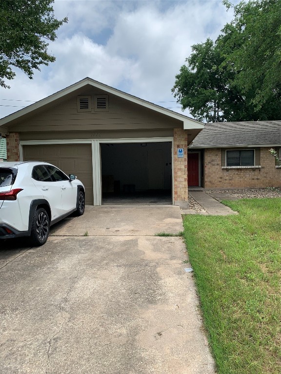 a view of a car parked in front of a house