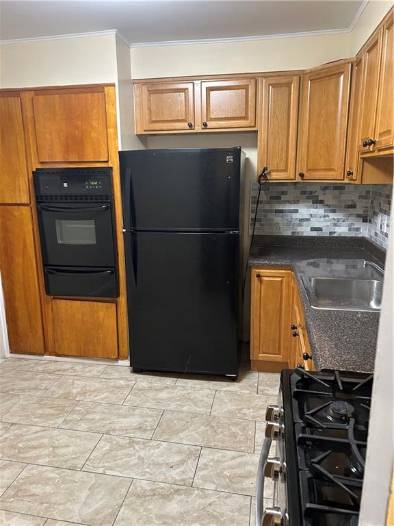 a kitchen with stainless steel appliances granite countertop a refrigerator and a stove