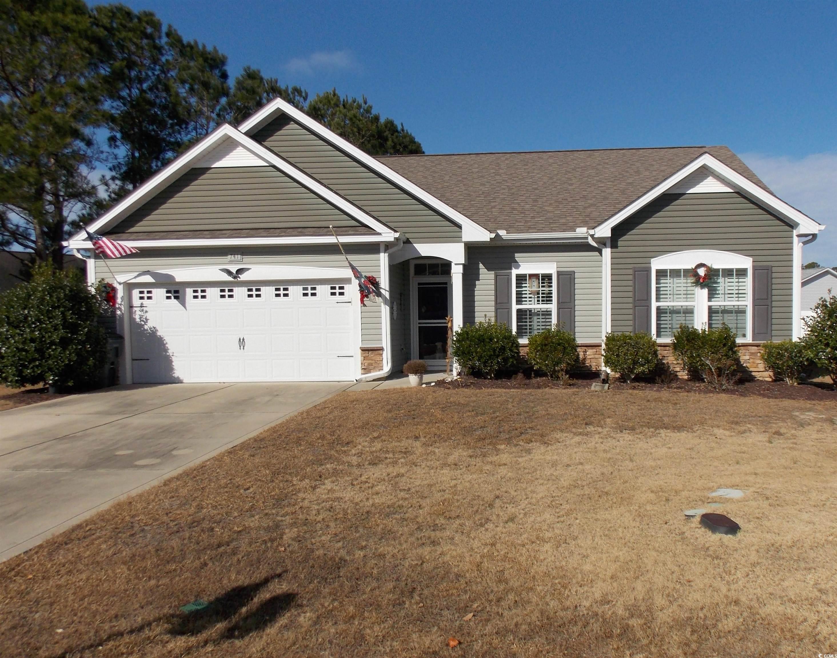 Single story home featuring a garage