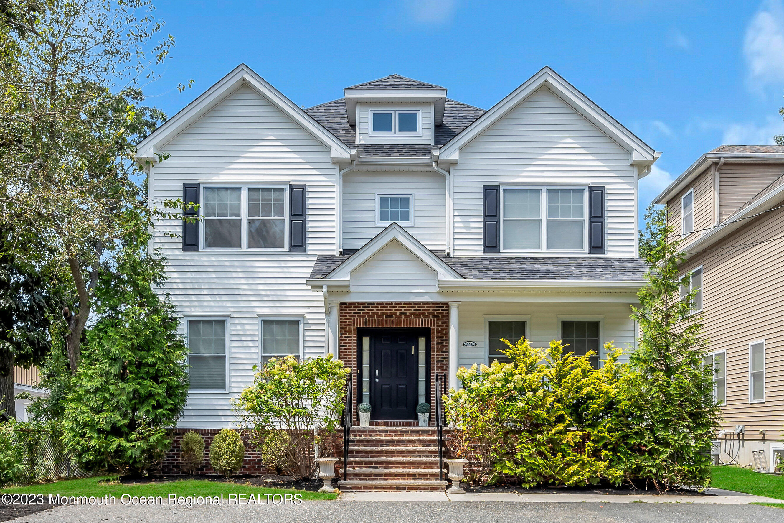 front view of a house with a yard