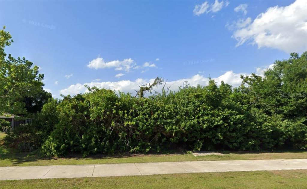 a view of swimming pool from a yard