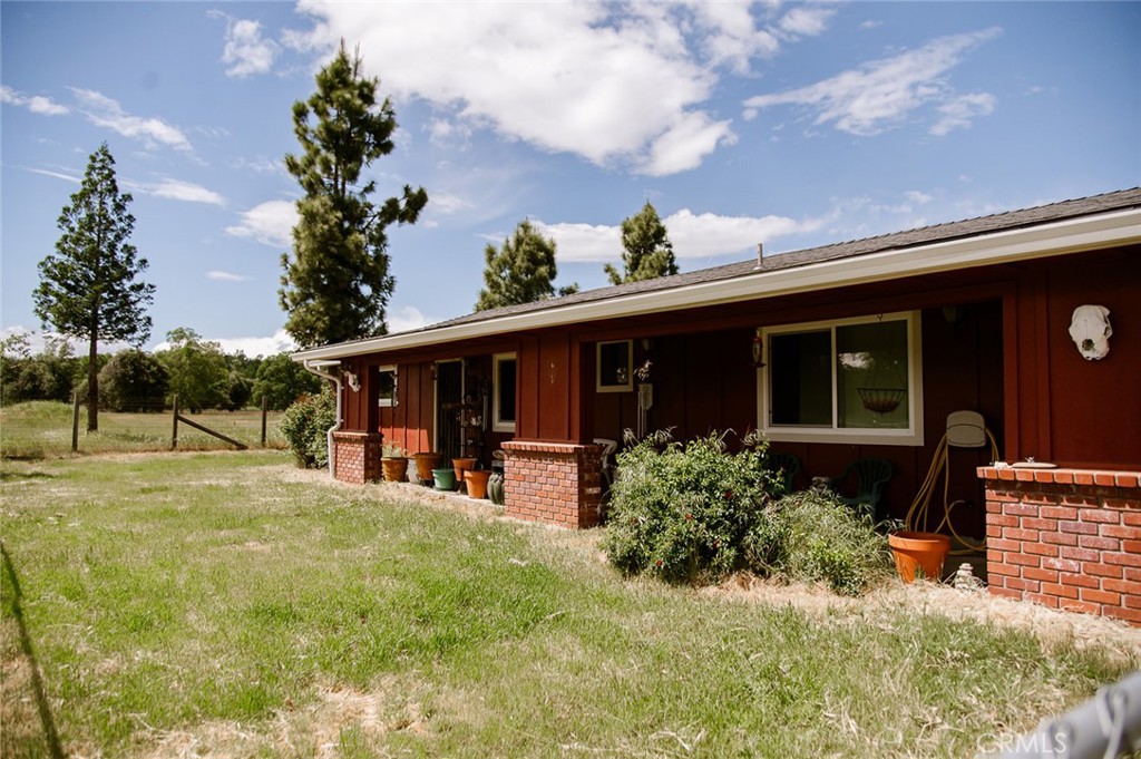 a front view of house with yard and seating space