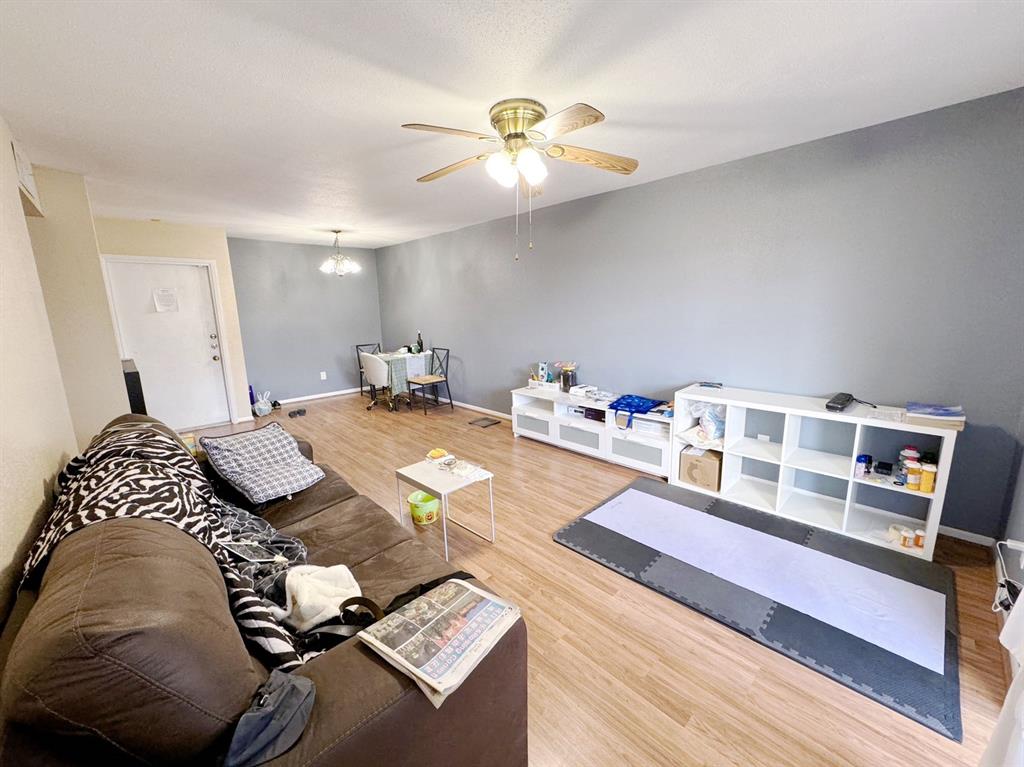 a bedroom with furniture and a chandelier