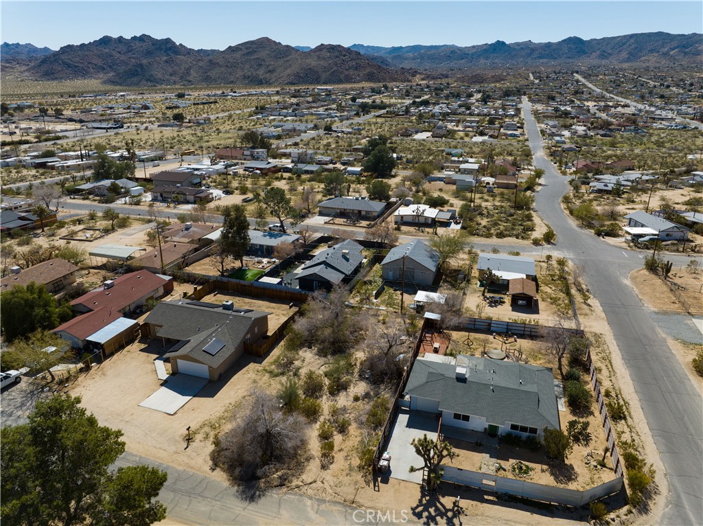 an aerial view of residential house with outdoor space