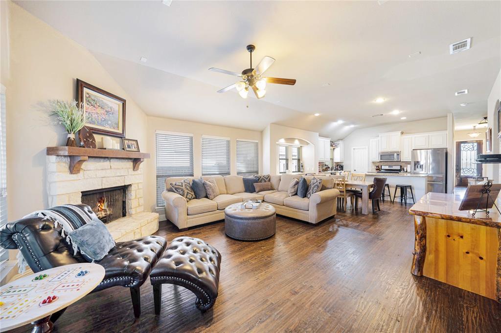 a living room with furniture potted plant and a fireplace