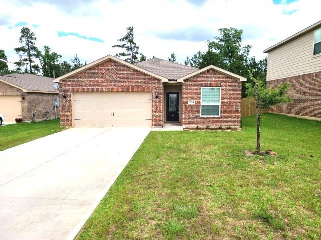 a front view of a house with yard